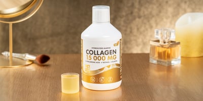 Bottle of hydrolyzed marine collagen 15,000 mg dietary supplement with hyaluronic acid, retinol, and elastin, presented on a wooden table with elegant background decor.